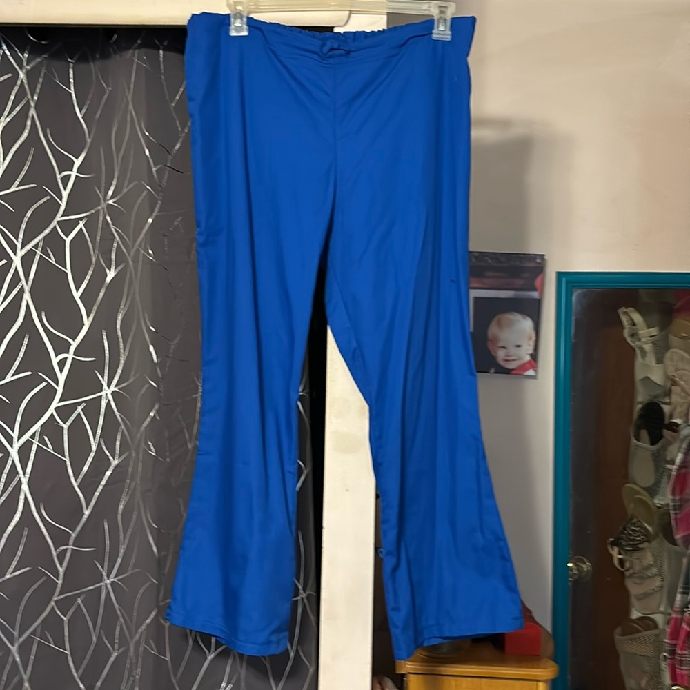 Royal blue uniform pants, elastic waist tie, front barely worn size med
